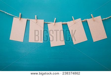 Hanging Vintage Label Tags On A Blue Background