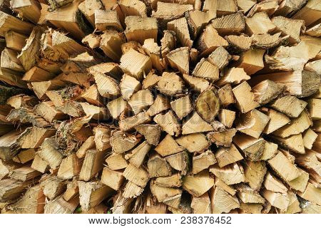 Pile Of Chopped Firewood Logs. Stack Of Wood Pieces. Pine Timber. Woodpile. Rural Home Concept. Stor