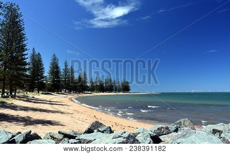Scarborough Beach On A Sunny Day At Christmas Time (redcliffe, Qld, Australia). Trees Around The Bea
