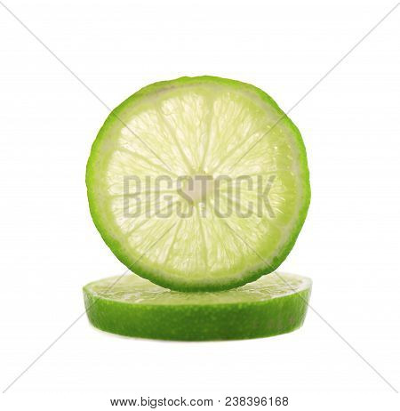 Ripe Slice Of Green Lime Citrus Fruit Isolated On White Background. Lime Wedge With Clipping Path.