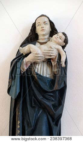 SISAK, CROATIA - DECEMBER 07: Virgin Mary with baby Jesus, statue in the Church of Visitation of the Virgin Mary in Sisak, Croatia, on December 07, 2017.