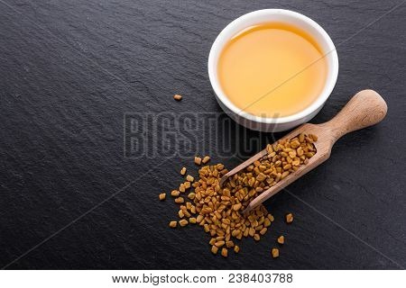 Fragrant Grains Of Fenugreek On A Rustic Background.