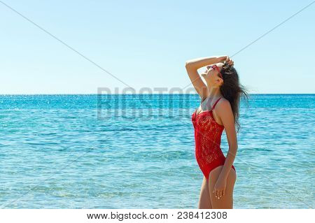 Beautiful Happy Woman On Tropical Beach In Swimsuit And Sunglassses.