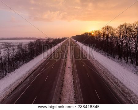 Beautiful Sunrise Aerial View Above Highway. Car Travel Concept
