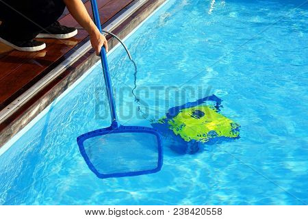 Pool Cleaner During His Work. Cleaning Robot For Cleaning The Botton Of Swimming Pools.