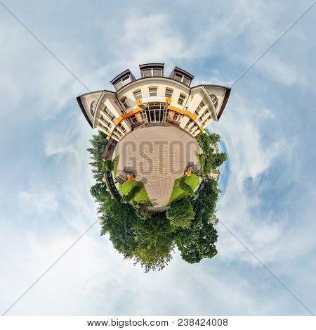 Tiny Little Planet With Trees Near Beautiful Building, White Clouds And Soft Blue Sky Of Amusement P
