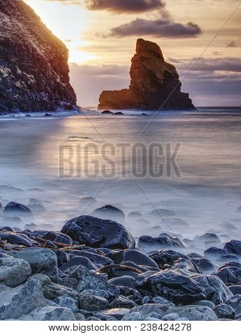 Rocky Coast Of Sea. Slow Shutter Speed For Smooth Water Level. Visite Talisker Bay On The Isle Of Sk