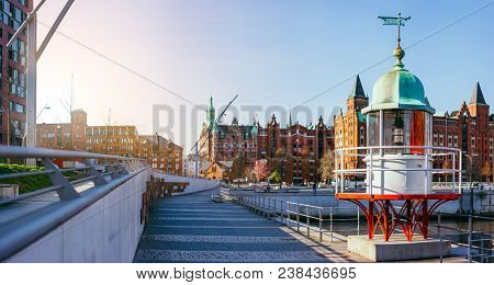 Panorama Of Hafencity With Old Beacon Lighthouse And Red Brick Building In Background, Speicherstadt