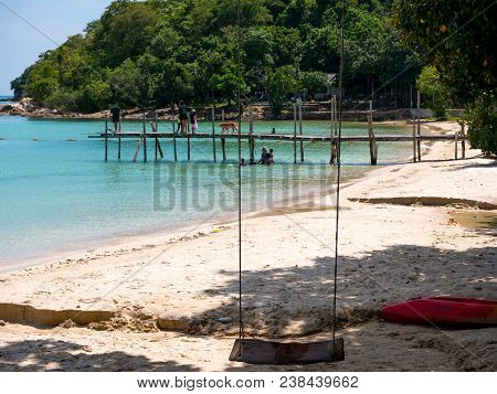 Dock And Swing At The Beach In Paradise