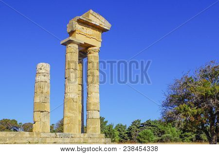 Antique Columns In The Ancient Acropolis Of The City Of Lindos On The Island Of Rhodes