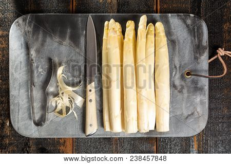 Top View, Fresh Tasty White Asparagus, Seasonal Vegetable, New Harvest, With Piller And Knife, Ready