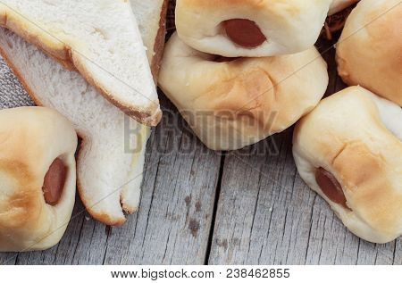 Bread Stuffed And Ham On Wooden Floor.