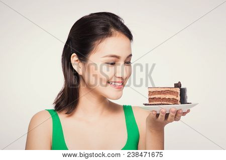 Beautiful Smiling Asian Young Woman With A Chocolate Cake Isolated On White Background.