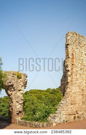 Heavily Fortified Castle Ruins Located On A Dramatic Promontory Overlooking The River Esk.