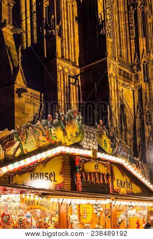 Strasbourg, France - December 11, 2011: Illuminated Christmas Fairground Pavilion Near The Cathedral