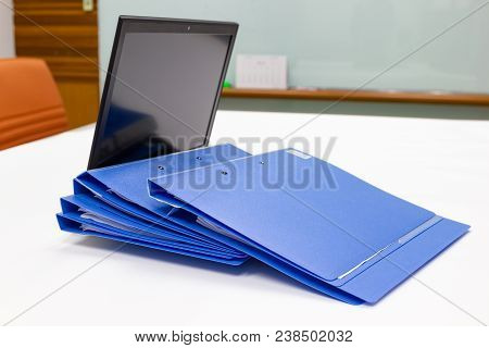 Blue File Folder With Documents And Notebook Background On The White Table Bisuness Concept.