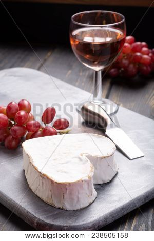 French Neufchatel Heart Shaped Aged White Cow Cheese From Normandy Served With Rose Wine