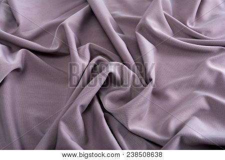 Smooth Gray Satin Silk Fabric. Folds, Curl. Satin Background.