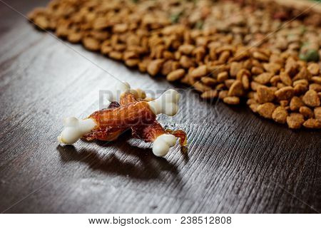 Calcium Bones For Dog Feeding On Wooden Background