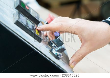 A Close-up Of The Operator The Man Presses The Button On The Control Panel With The Control Devices 