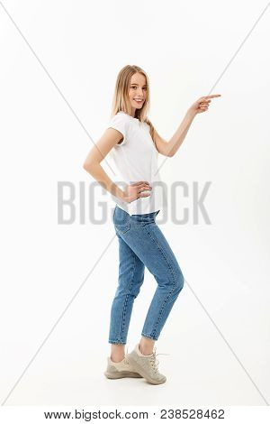 Lifestyle Concept: Portrait Woman Pointing Or Pushing Something With Index Finger. Beautiful Casual 