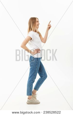 Lifestyle Concept: Portrait Woman Pointing Or Pushing Something With Index Finger. Beautiful Casual 
