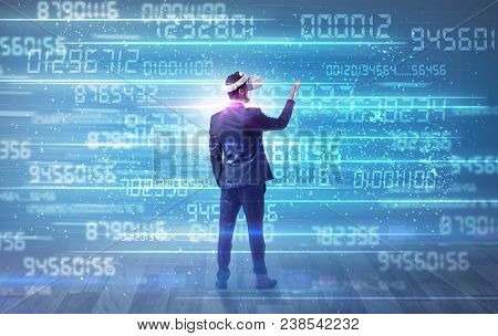 Businessman in vr glasses with variable fast changing numbers around