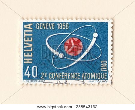 Leeds, England - April 30 2018: An Old Swiss Postage Stamp Commemorating The 1958 Atomic Conference 