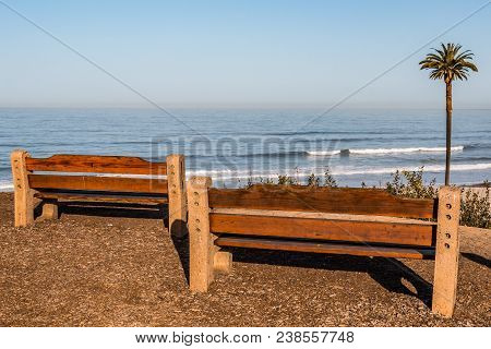 Two Benches At A Viewpoint Overlooking Moonlight Beach And The Iconic Canary Island Date Palm In Enc