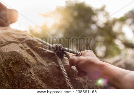 Men Climbing On Rock Outdoor, Close-up Image Of Climber Hand