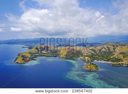 Beautiful Aerial View Of Beaches And Tourist Boat Sailing In Flores Island, Indonesia.