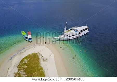 Beautiful Aerial View Of Beaches And Tourist Boat Sailing In Flores Island, Indonesia.