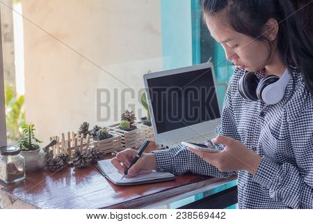 Businesswomen Using Cellphone Working In Coffee Shop.the Concept Of Remote Work Business Lady.