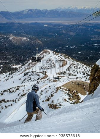Male Skier Starting His Run At The Summit Of Mammoth Mountain