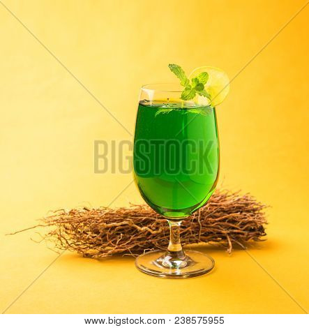 Green Khus Sharbat Or Vetiver Grass Extract Or Chrysopogon Zizanioides Served In Tall Glass With Min