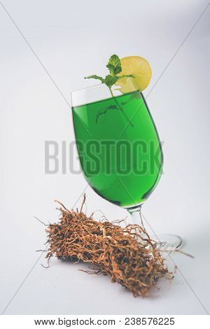 Green Khus Sharbat Or Vetiver Grass Extract Or Chrysopogon Zizanioides Served In Tall Glass With Min
