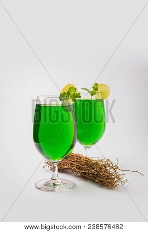 Green Khus Sharbat Or Vetiver Grass Extract Or Chrysopogon Zizanioides Served In Tall Glass With Min