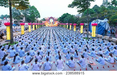Ho Chi Minh City, Vietnam - January 3, 2018: Buddhist Party Came Prepared With Hundreds Candles Line