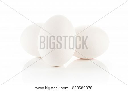 Three White Chicken Eggs Stack Isolated On White Background