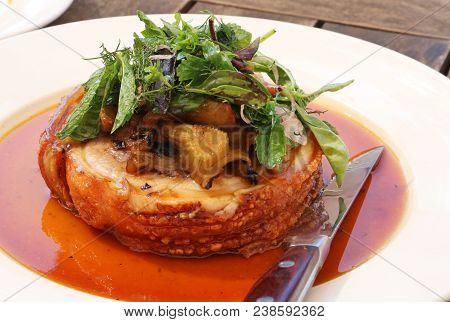 Trussed Pork Belly, With Braised Basil, Shallots, Fennel Served In Deicious Gravy