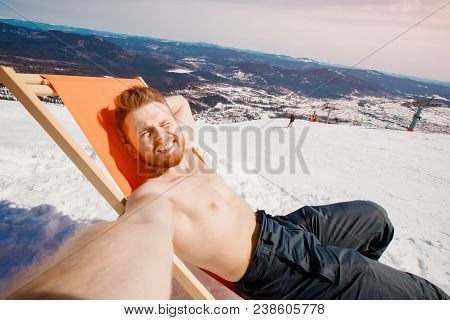 Chair Relax Lounges Winter Against Blue Sky With Sun And Mountains. Grelka Fest