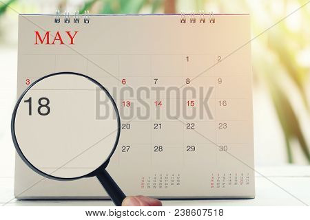 Magnifying Glass In Hand On Calendar You Can Look Eighteen Days Of Month,focus Number Eighteen In Ma