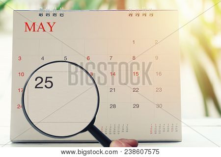 Magnifying Glass In Hand On Calendar You Can Look Twenty Five Day Of Month,focus Number Twenty Five 