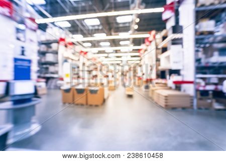 Blurred Large Furniture Warehouse Customer Shopping In America