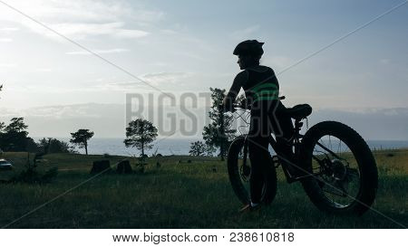 Fat Bike Also Called Fatbike Or Fat-tire Bike In Summer Riding In The Forest. Beautiful Girl And Her