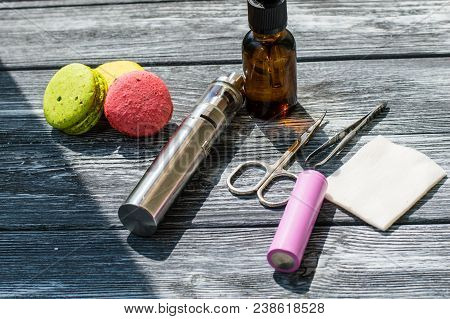 Still Life With E-cig And Jiuce On The Wooden Background