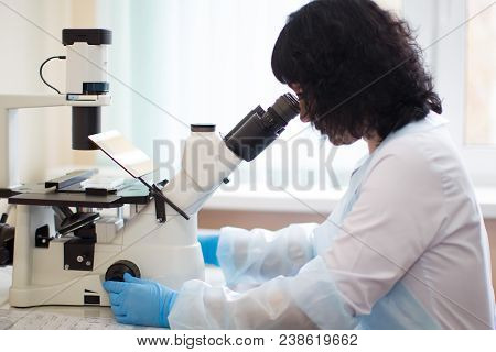 Belarus, Gomel, 24 April 2018. Blood Transfusion Station.a Lab Assistant Looks Through A Microscope