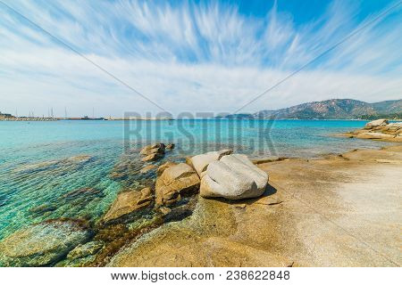 Rocks And Turquoise Water In Spiaggia Del Riso In Villasimius. Sardinia, Italy