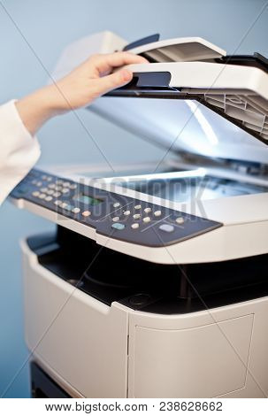 Woman's Hand With Working Copier