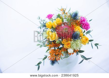 Colorful Bouquet Of Yellow, Coral And Rose Roses, Blue Eringium, Red Leucospermum, Orange Asclepia, 